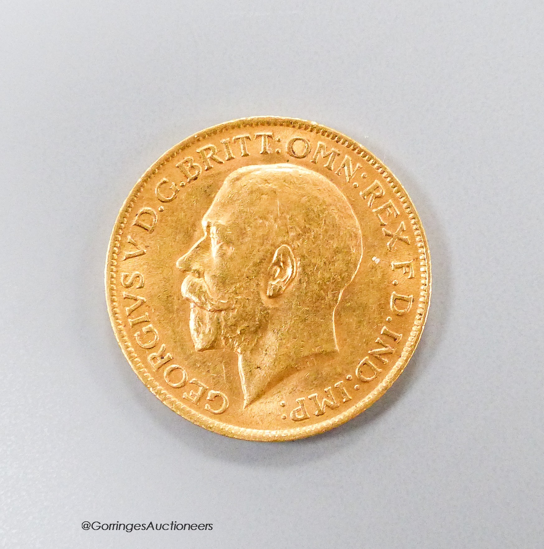 A George V 1912 gold sovereign, GVF.